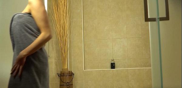  Busty seduction Cara Brett fingers wet pussy in the shower until she cums